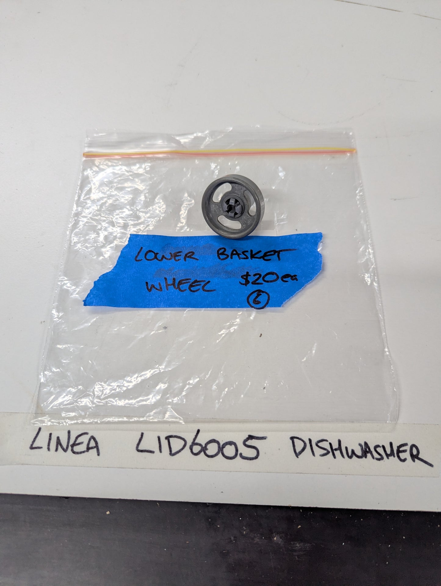 LINEA LID6005 dishwasher lower basket wheel in clear bag with blue label