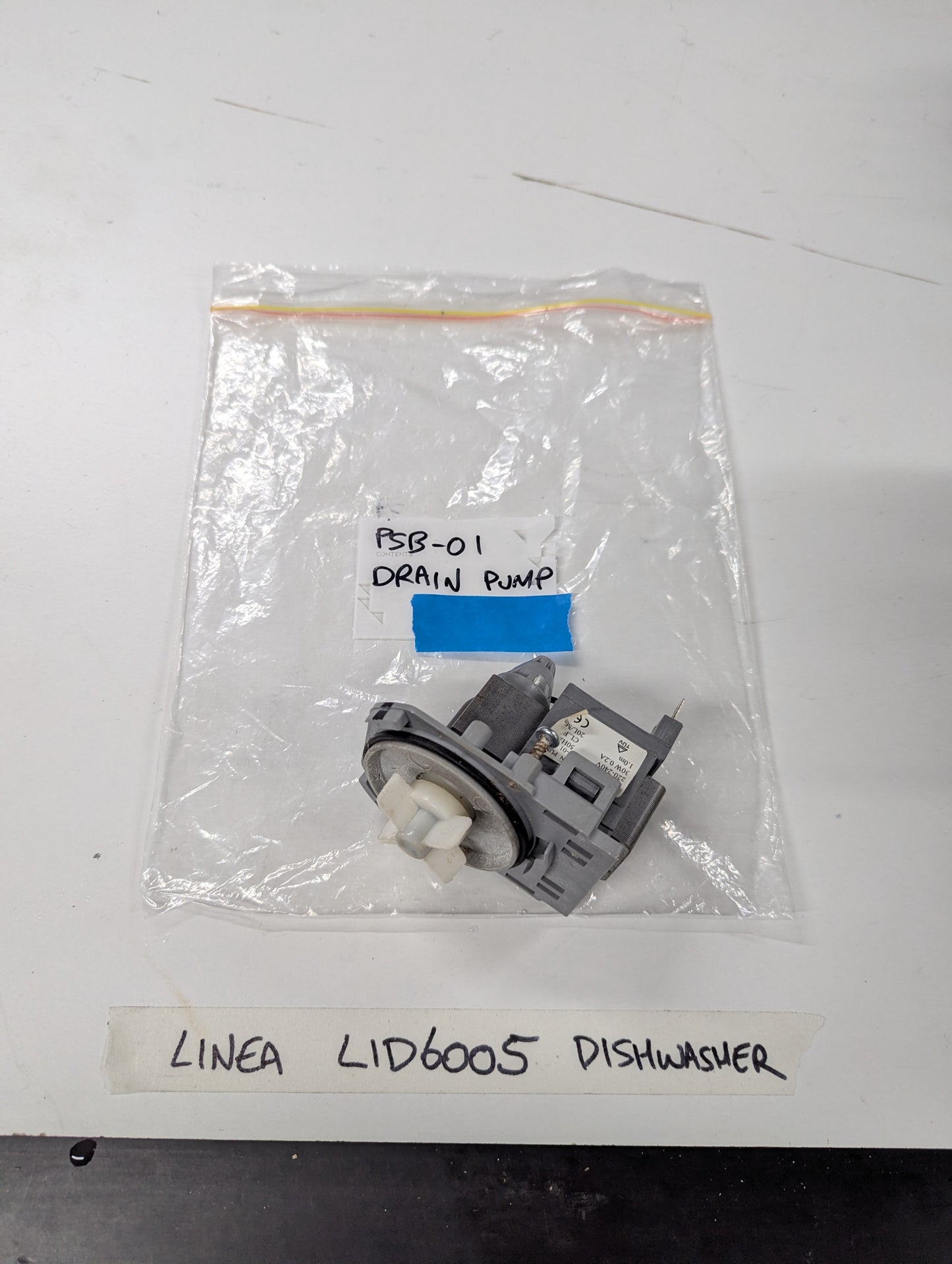 LINEA LID6005 dishwasher drain pump replacement part on white surface