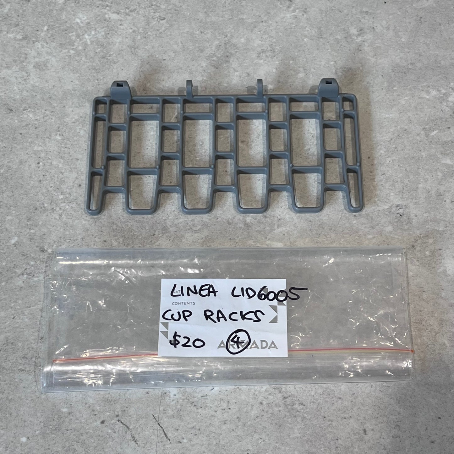 Linea LID6005 gray plastic cup rack with labeled bag