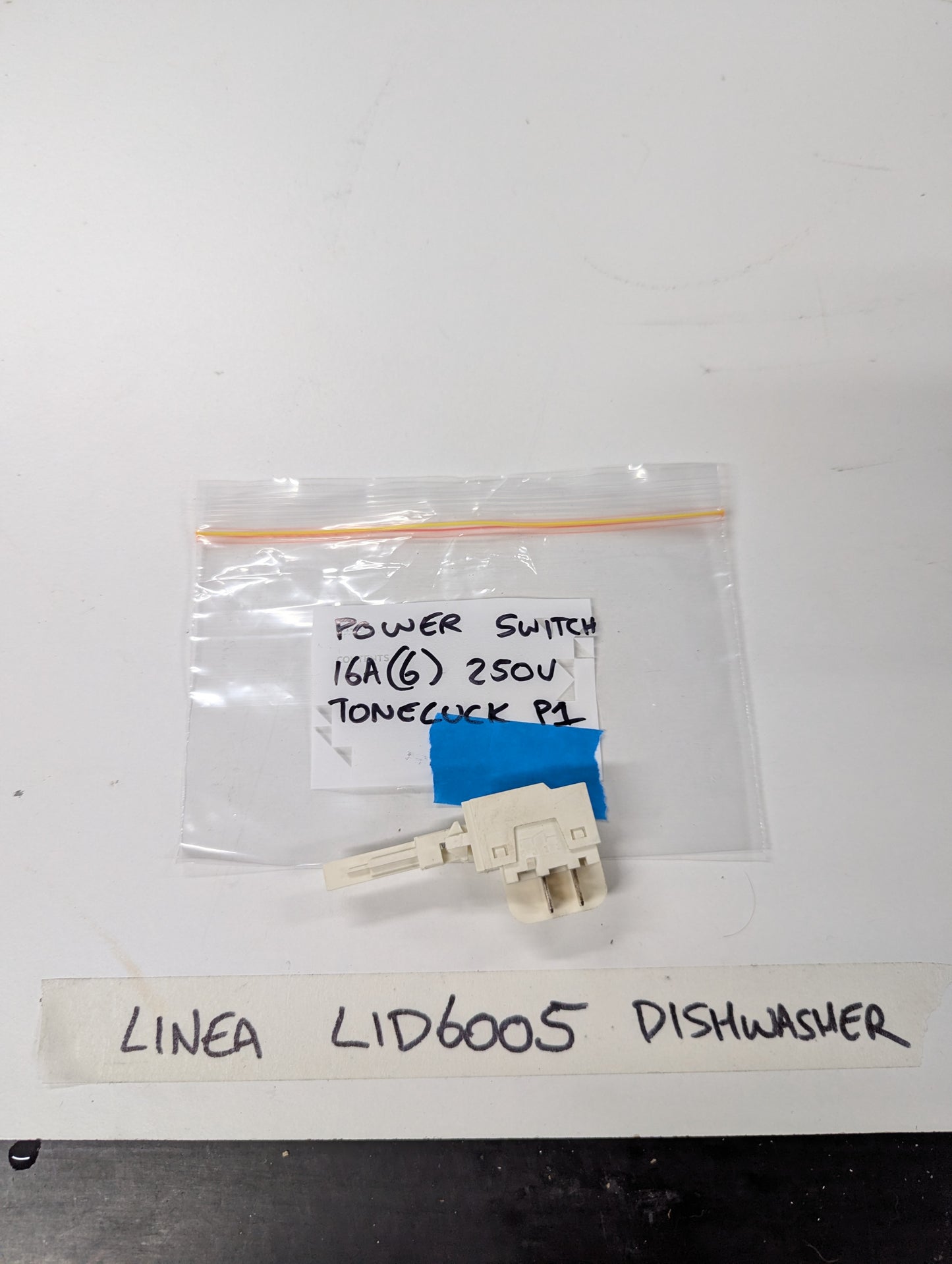 Linea LID6005 dishwasher power switch replacement photographed on a white surface