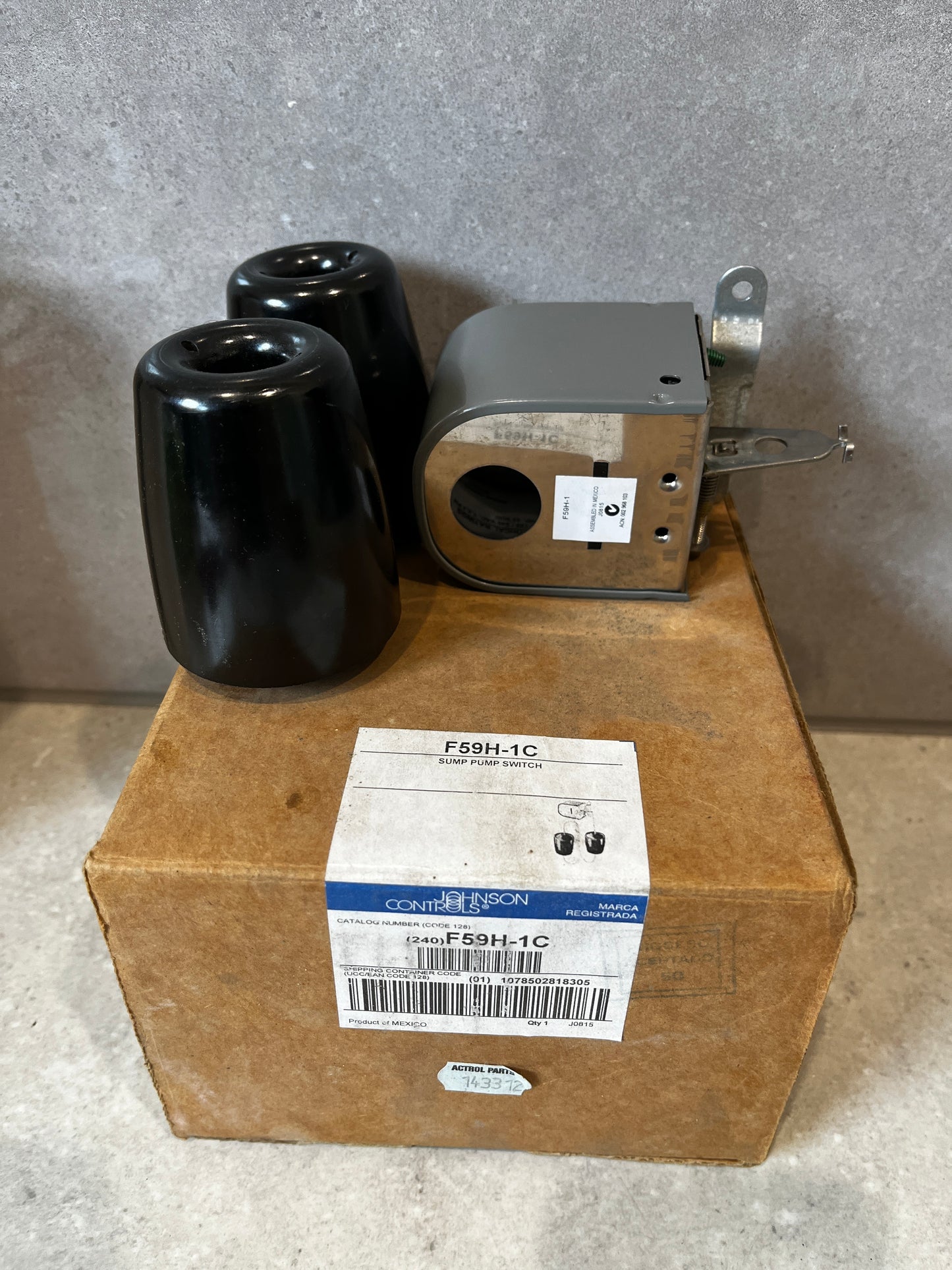 Johnson Controls F59H-1C sump pump switch and components on a box