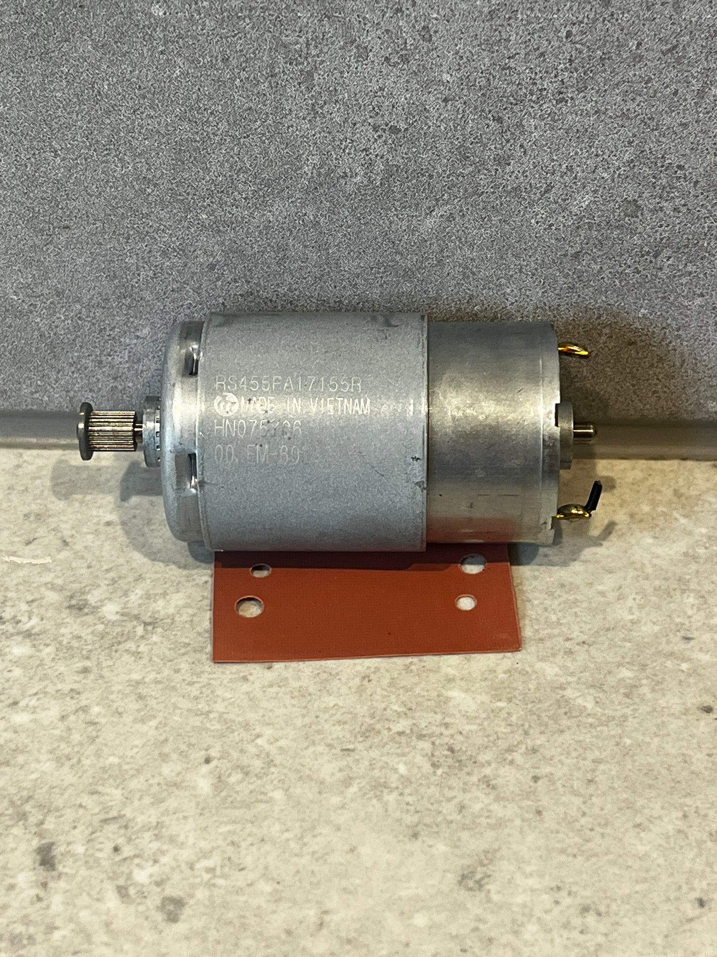 DC electric motor with metal housing and gear shaft