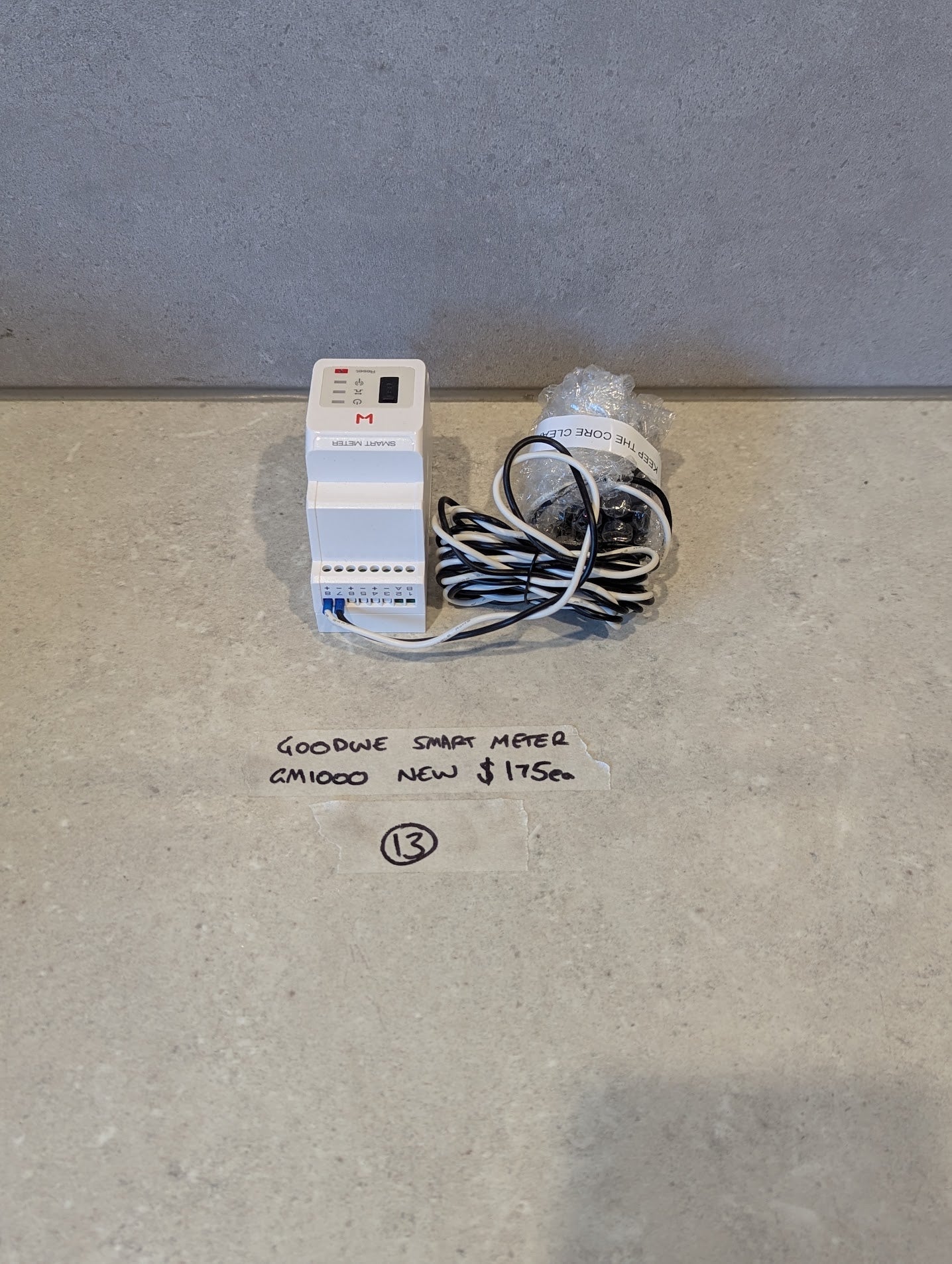 GoodWe GM1000 Smart Meter with wiring and display on a counter