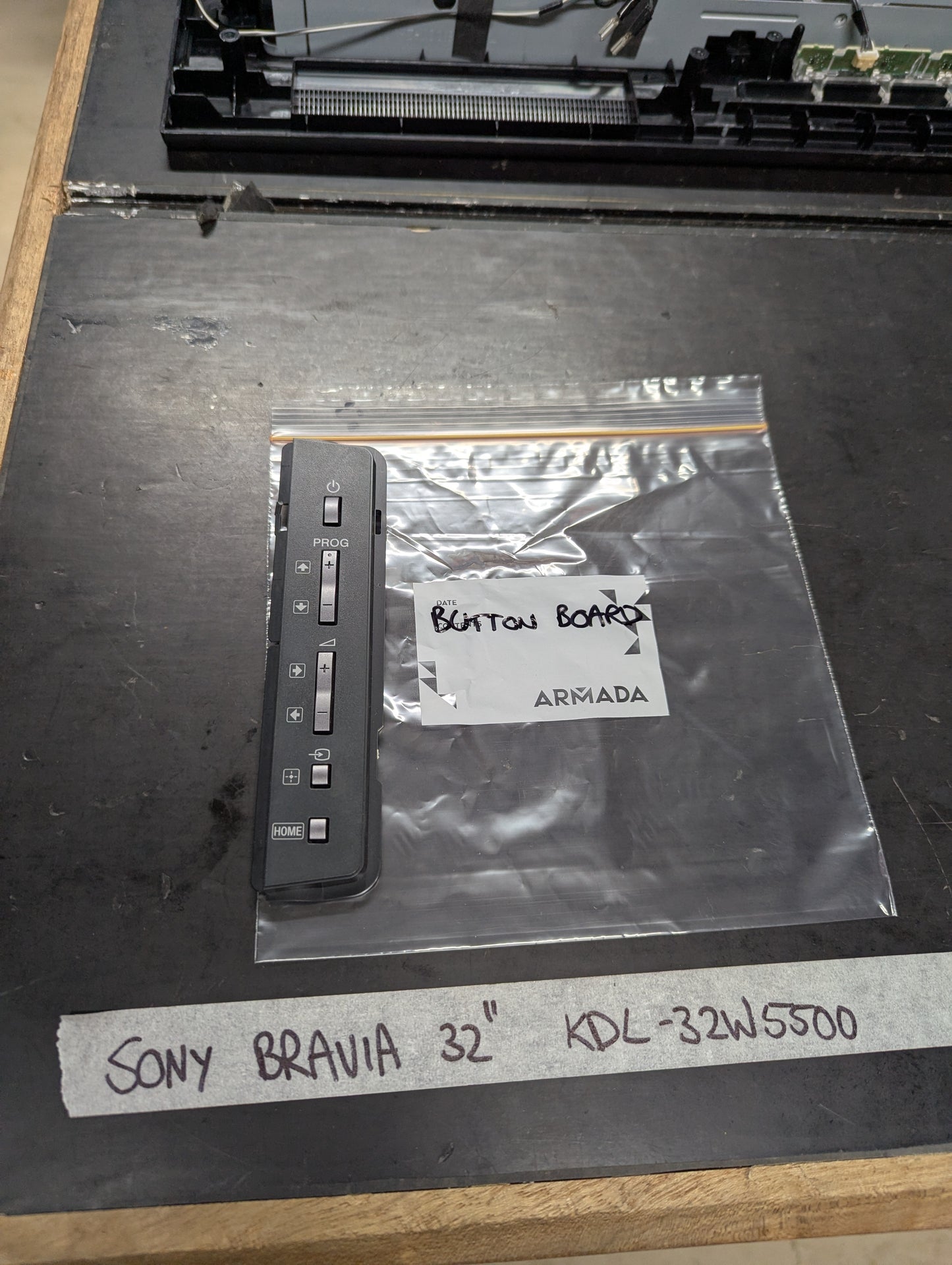 Sony Bravia KDL-32W5500 button board replacement part on a table