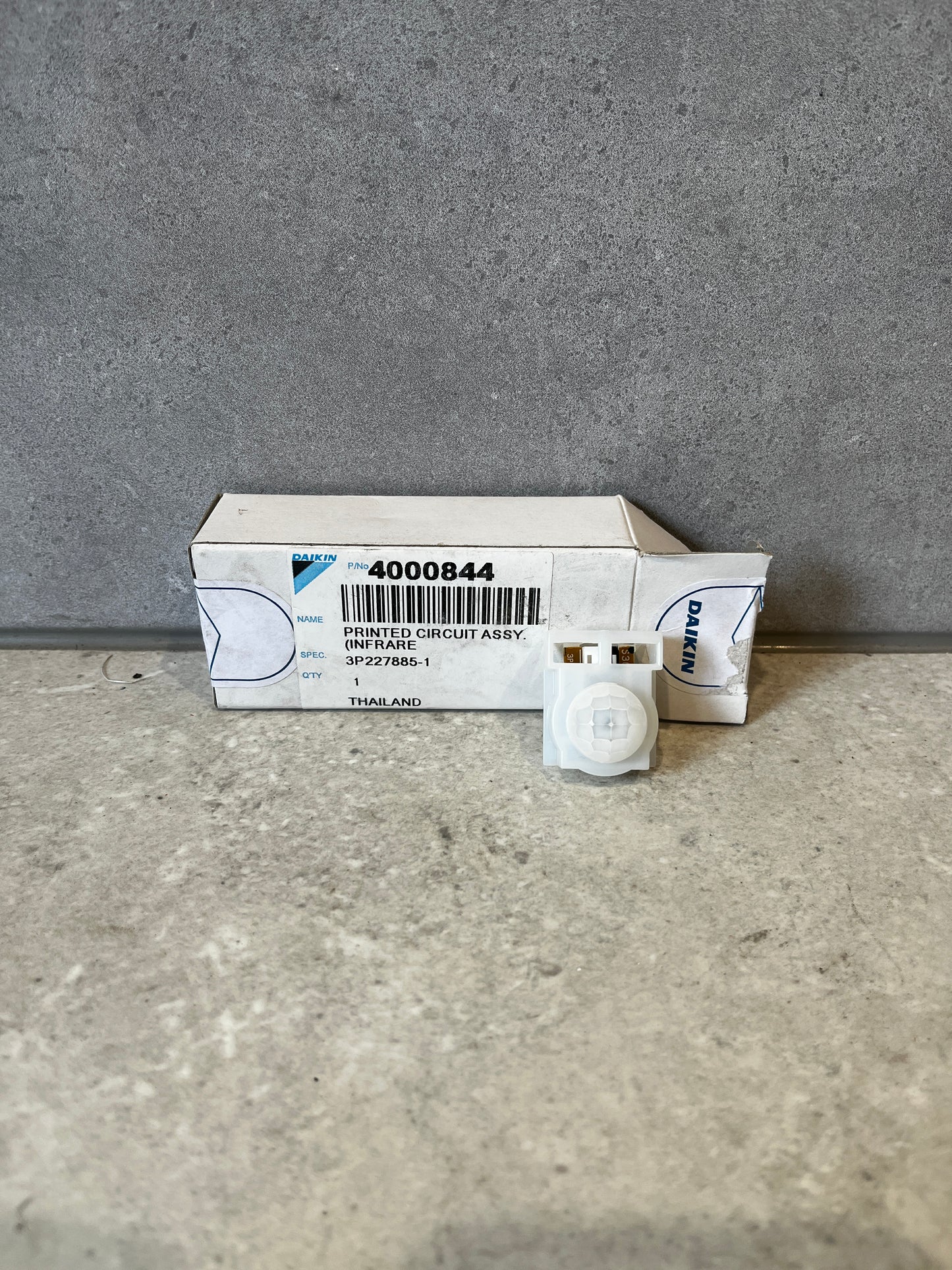 Daikin infrared circuit assembly with packaging on concrete surface