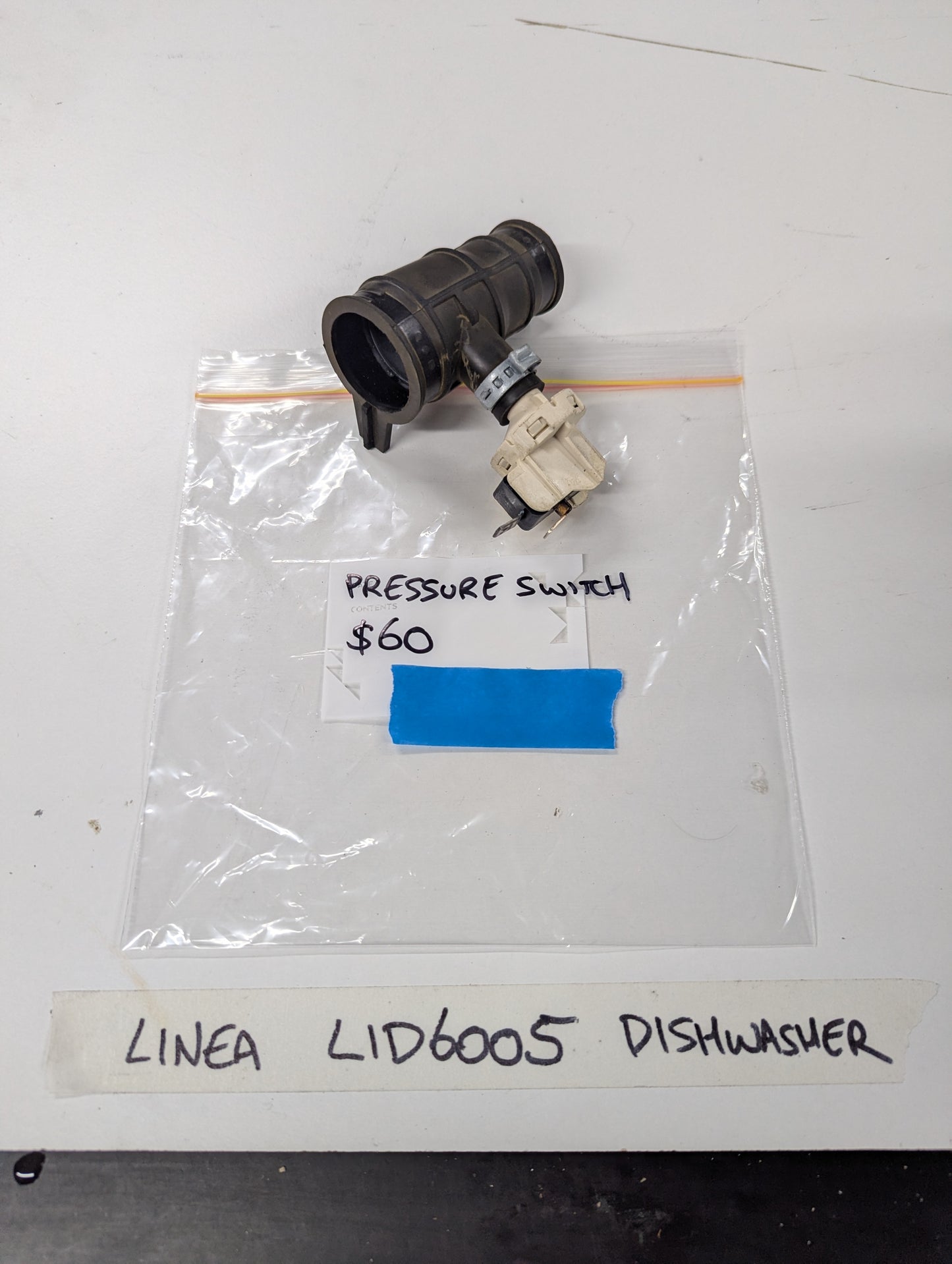 Linea LID6005 dishwasher pressure switch component on tabletop
