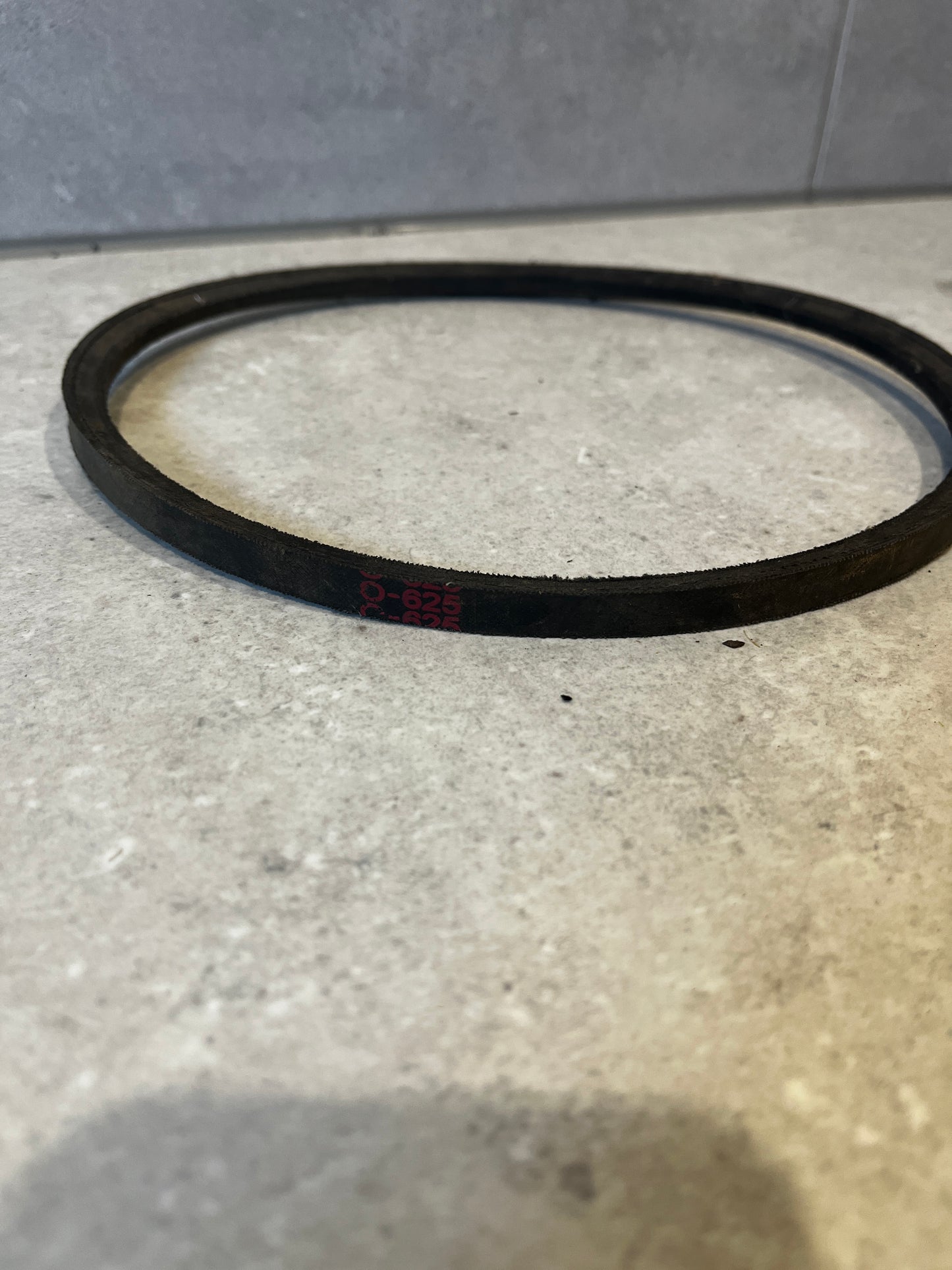 Side view of industrial rubber drive belt showing size marking