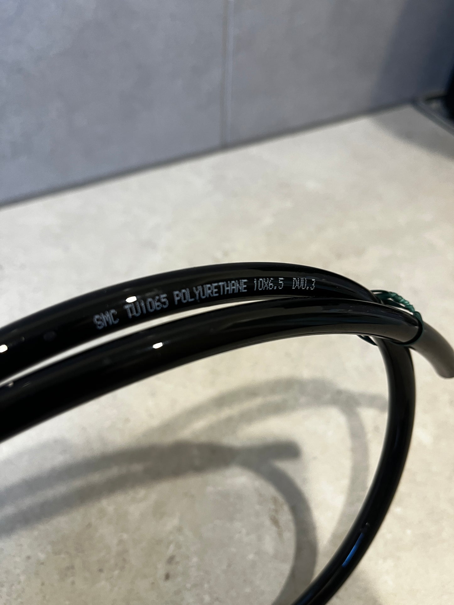 Close-up of polyurethane tubing with size and material details printed