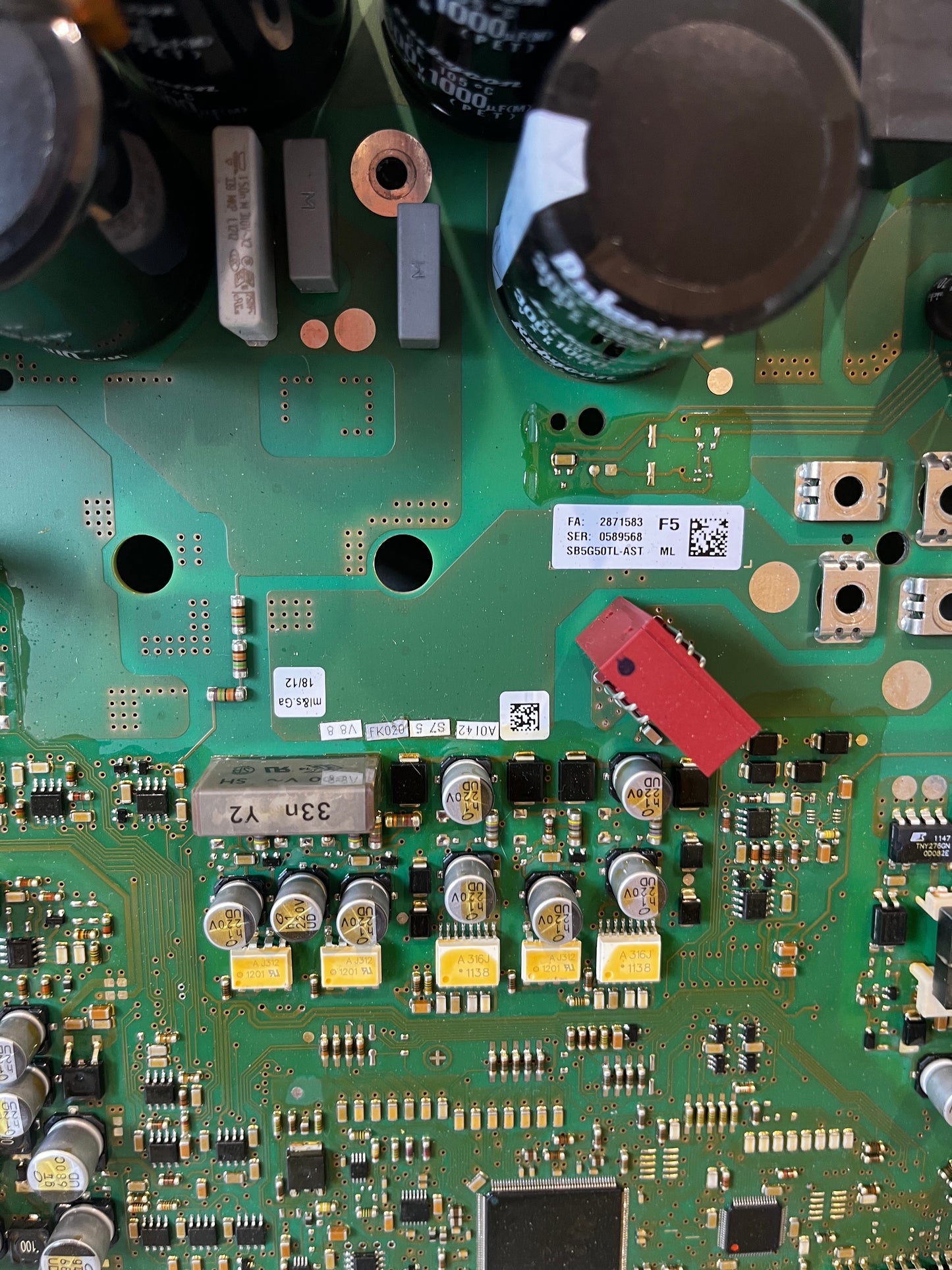 Close-up view of electronic components and capacitors on circuit board