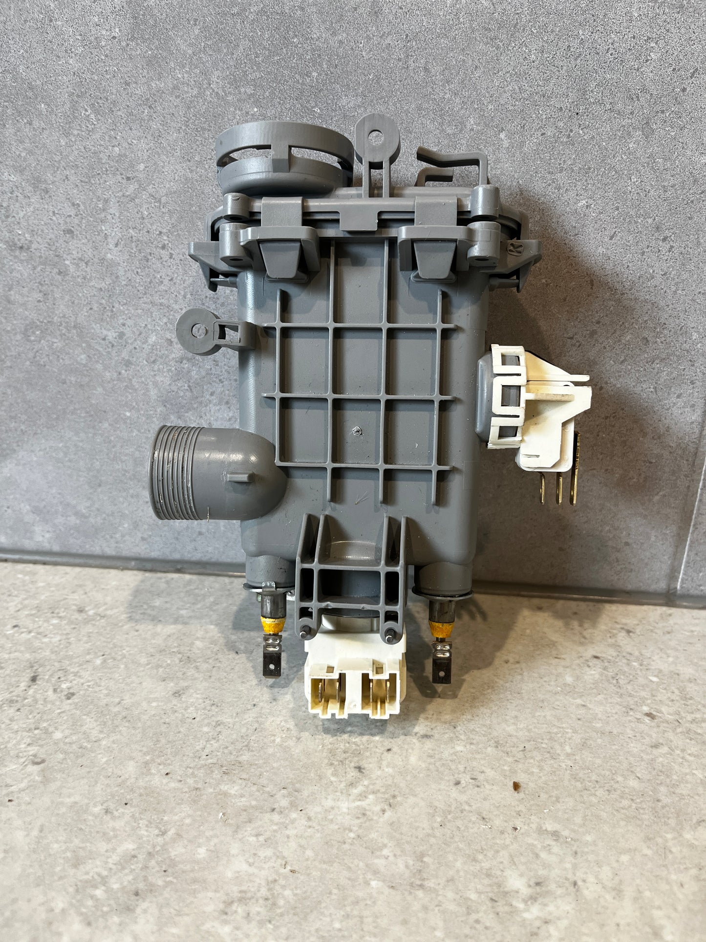 Back view of universal dishwasher heating element assembly showing terminals and plastic housing