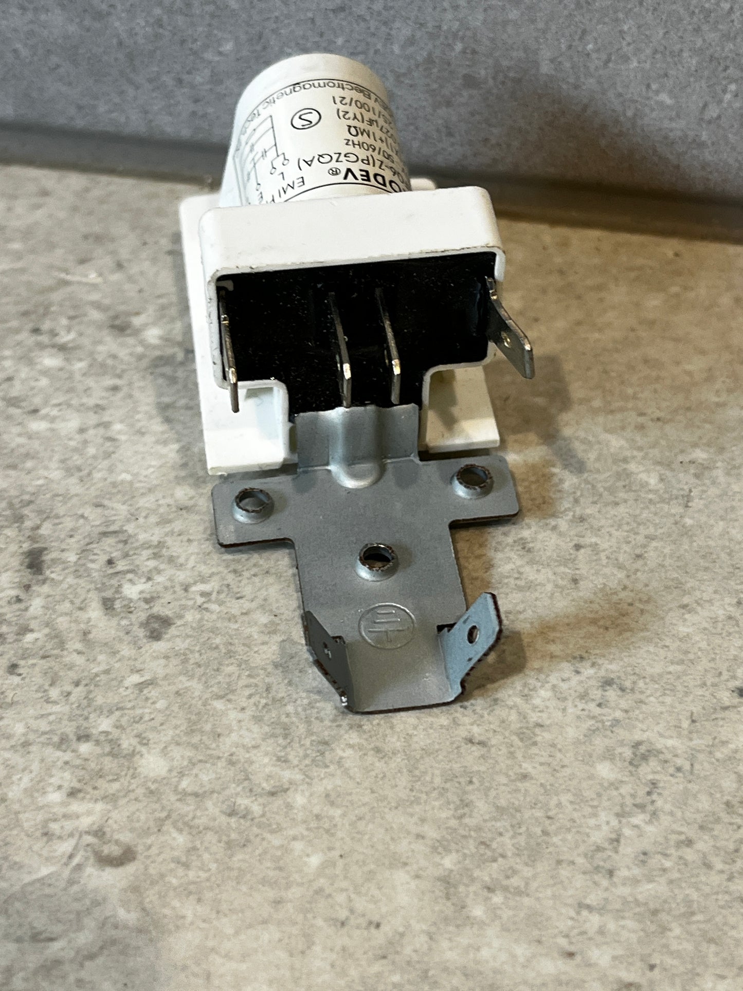 Rear view of AERODEV EMI filter module showing mounting bracket and connector pins