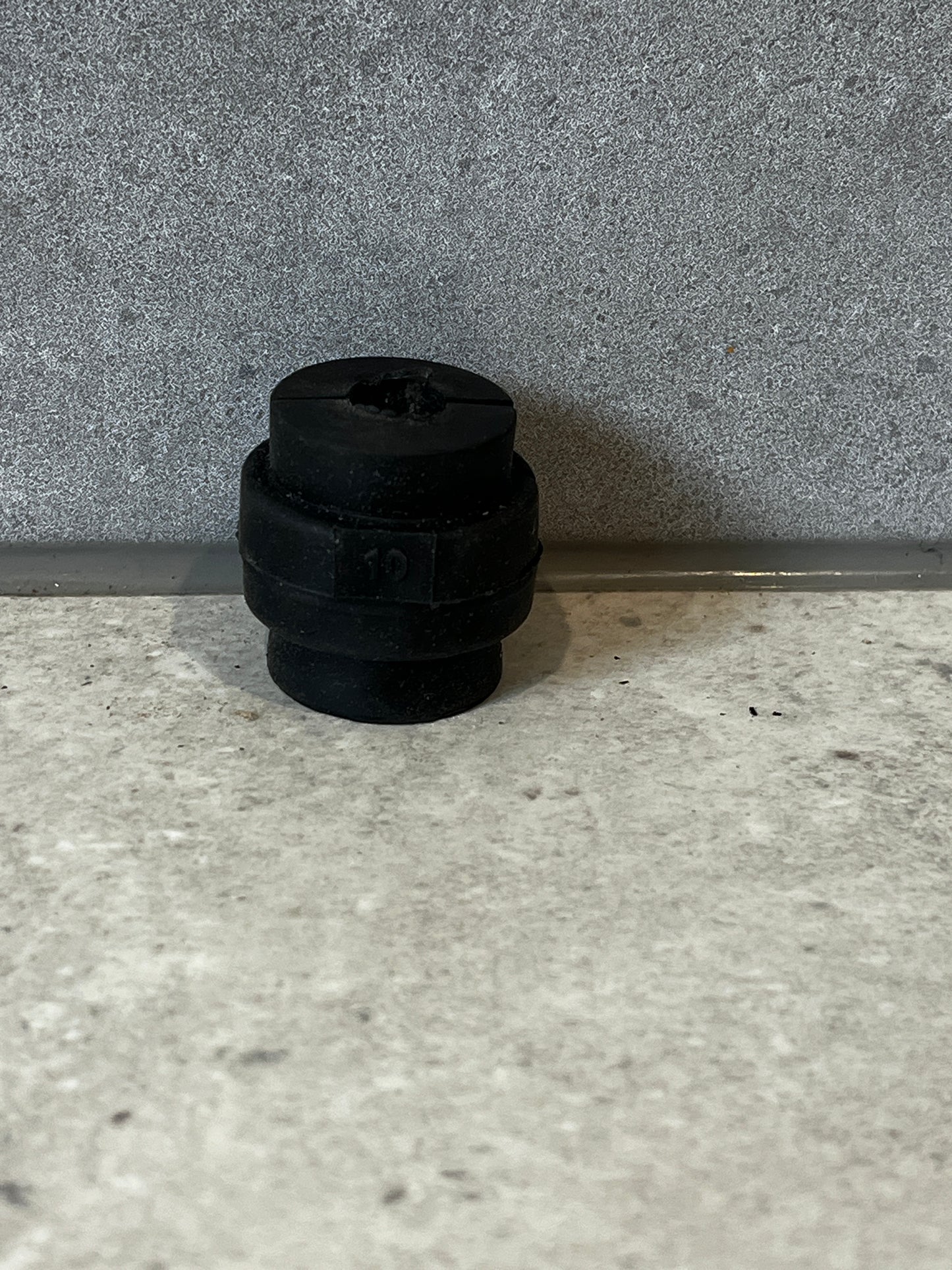 Single 10mm rubber insert sound insulation inlay on gray surface