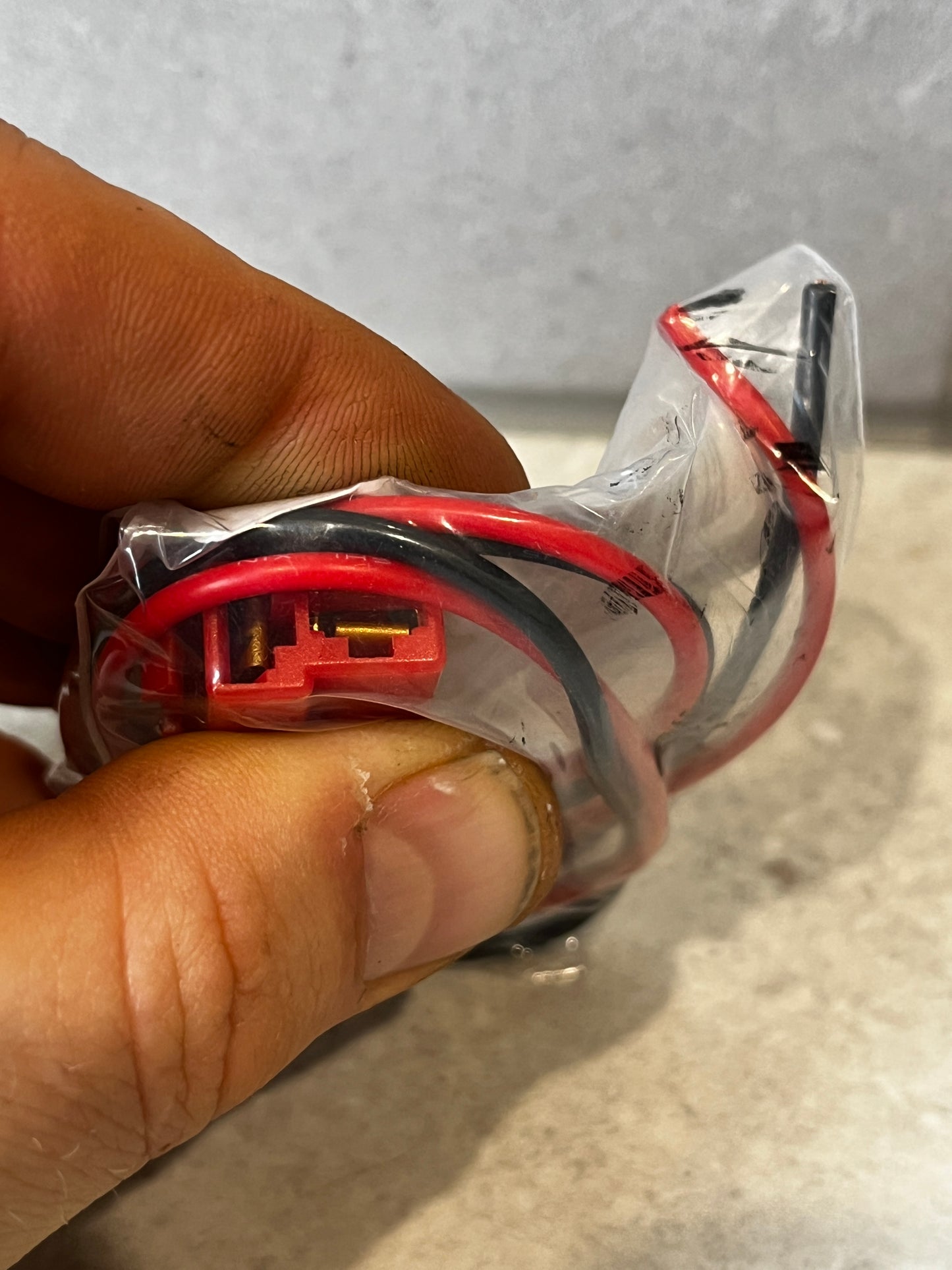 Close-up of heavy duty electrical wire harness connector showing terminals