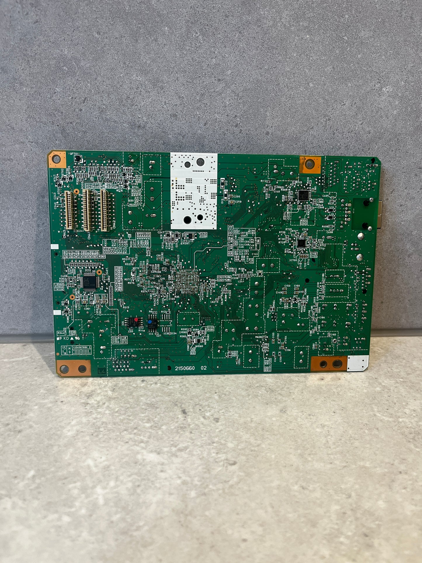 Back view of Epson circuit board showing solder points and circuitry