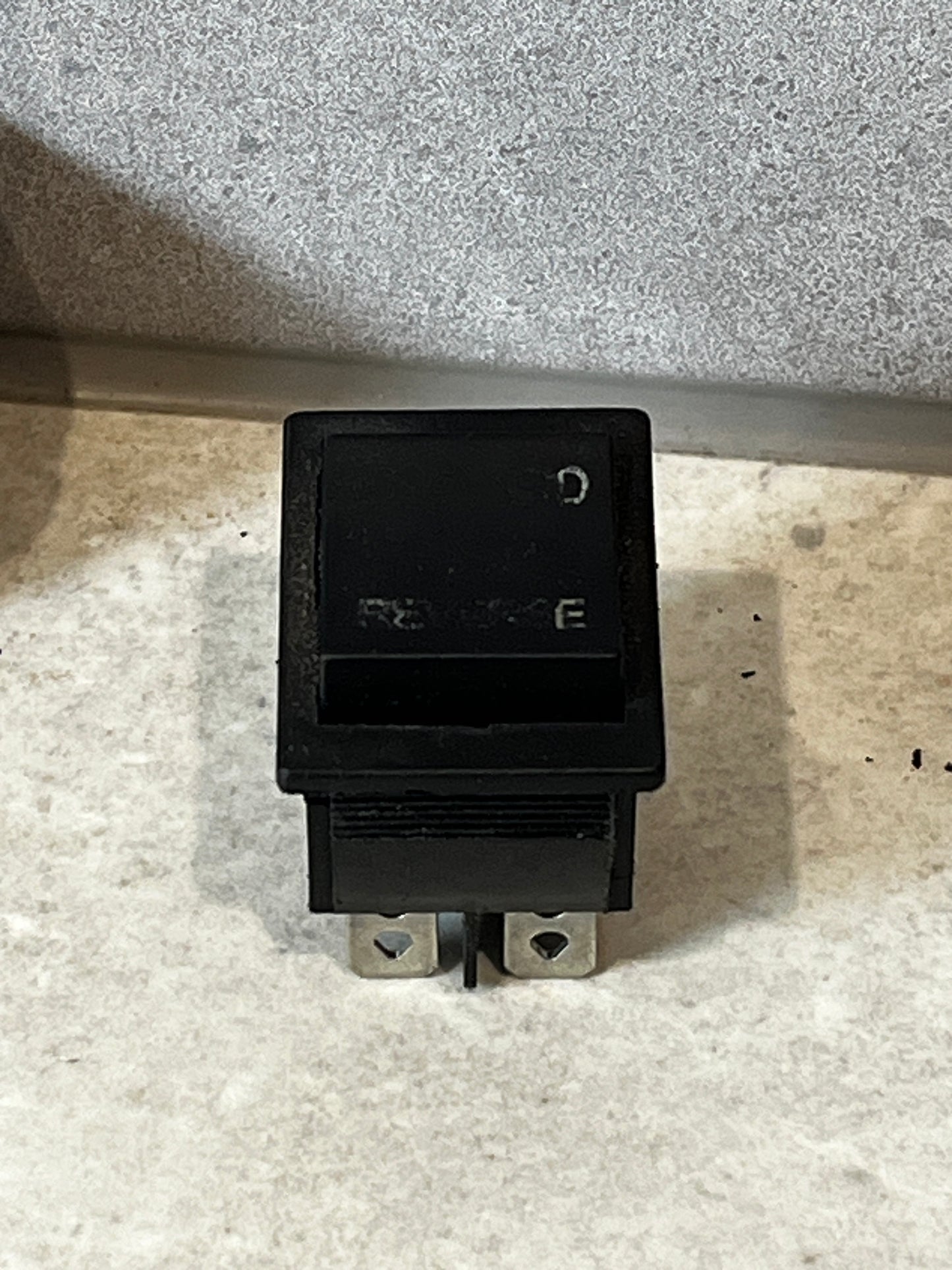 Top view of heavy duty rocker switch with visible terminals