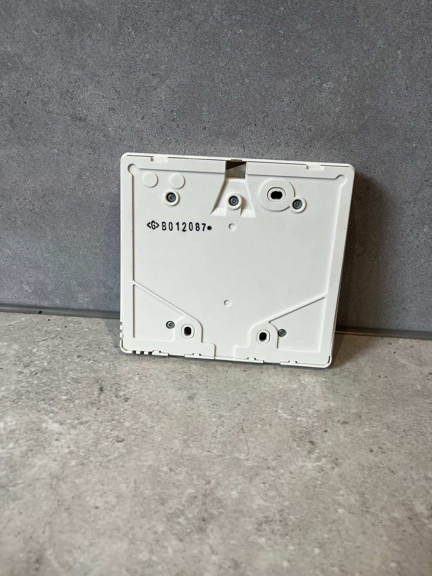 Back view of Mitsubishi Electric PAR-21MAA remote controller showing mounting points