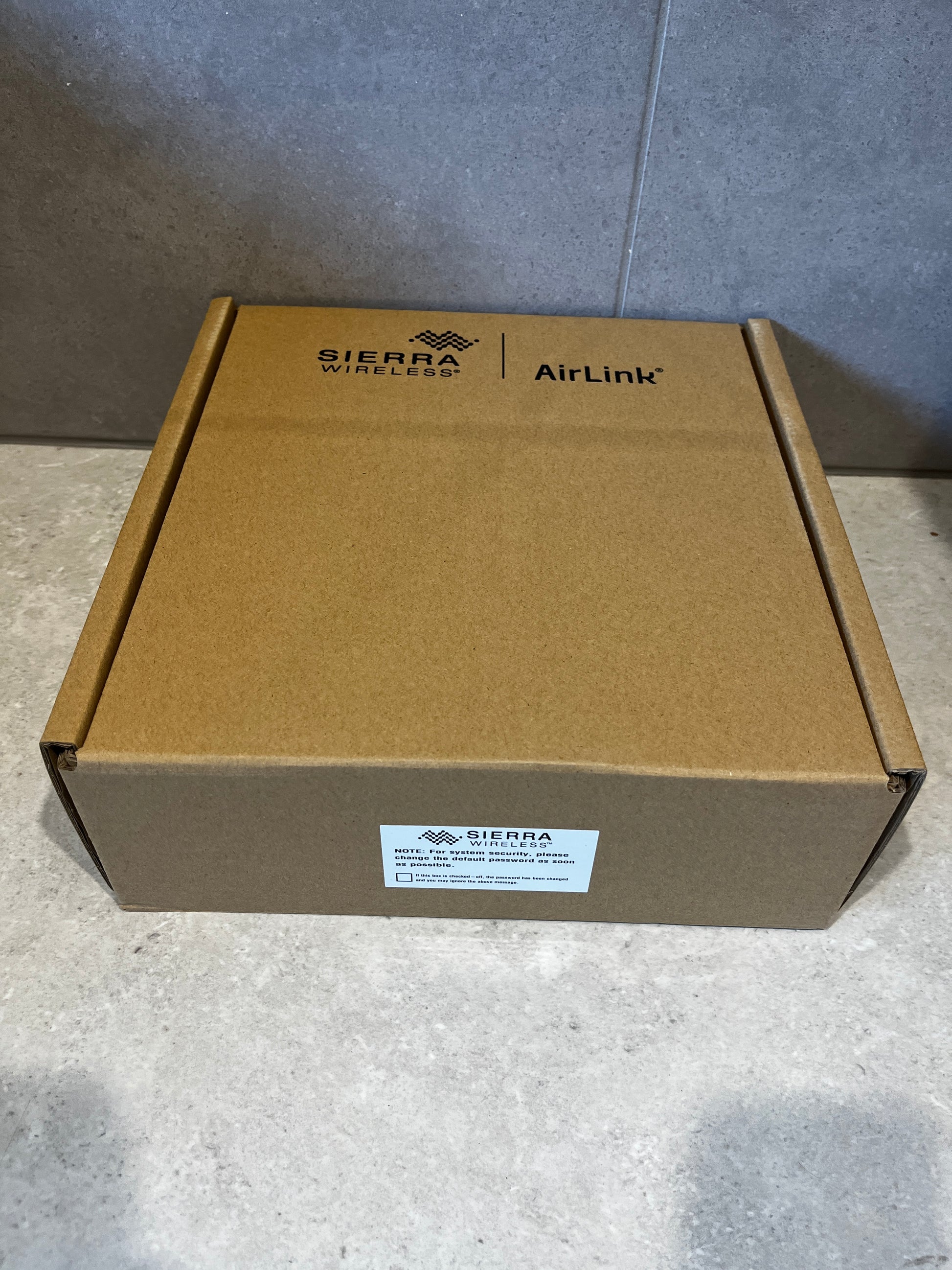 Sierra Wireless AirLink XR80 router boxed in brown cardboard packaging