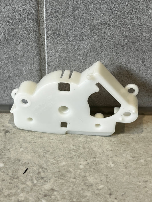 Front view of white plastic mechanical lever bracket on stone background