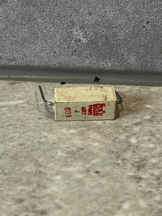 Rectangular wirewound ceramic power resistor with red printed specifications and wire leads