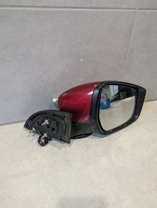 Red right side car mirror assembly showing mounting bolts and mirror glass