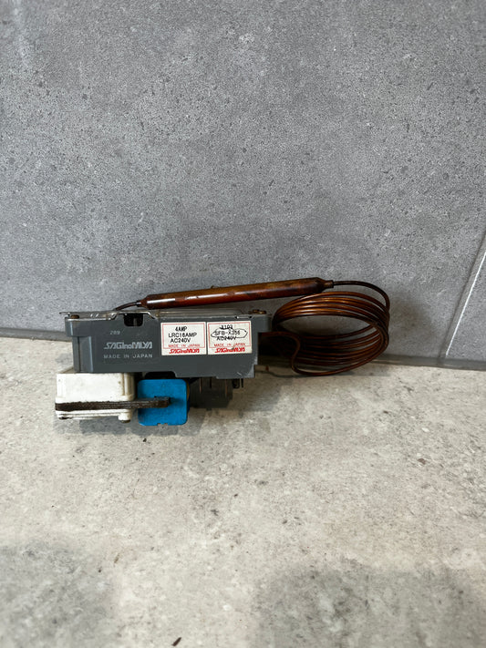 Saginomiya capillary thermostat switch unit with coil on gray surface