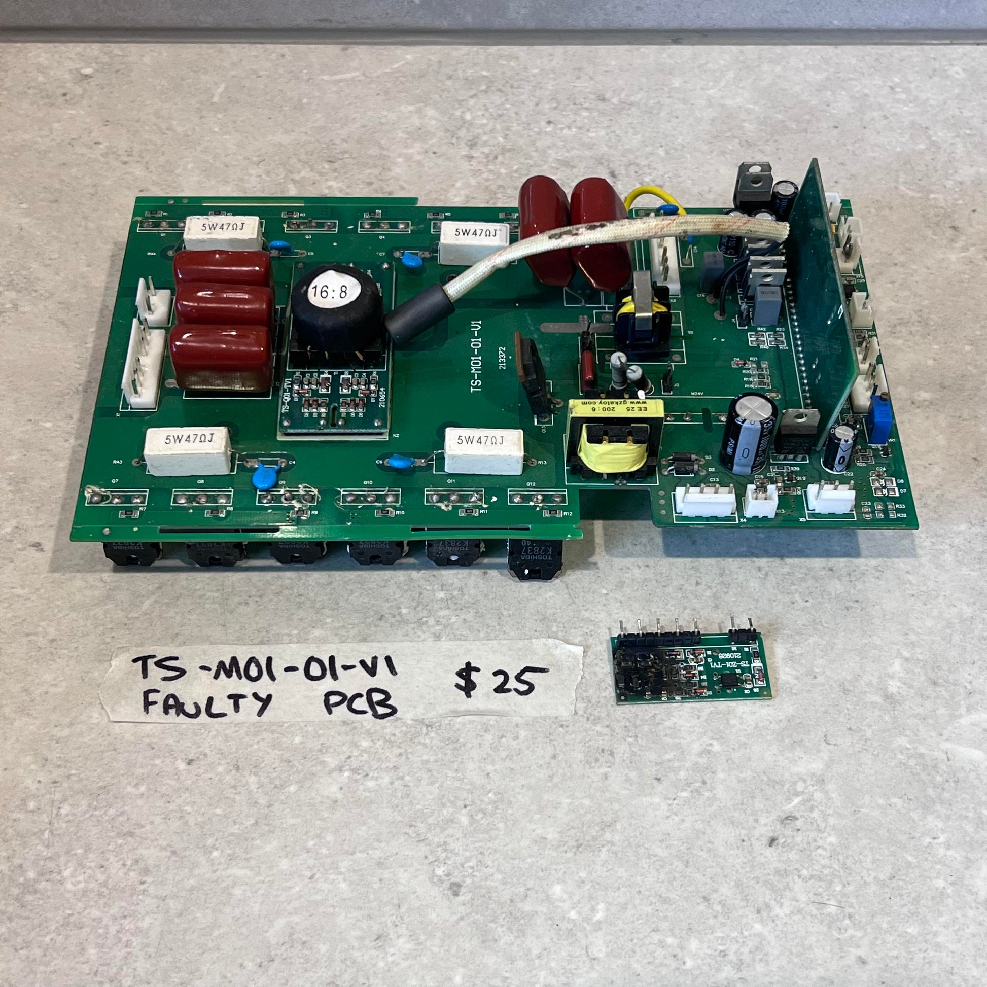 Faulty TS-M01-01-V1 PCB board and smaller circuit board from CUT50 Plasma Cutter, labeled with price and description