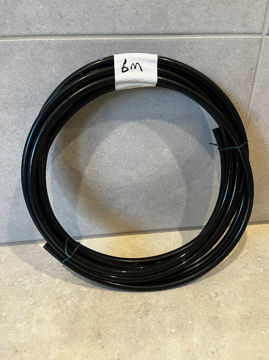 Coiled black tubing measuring 6 meters in length