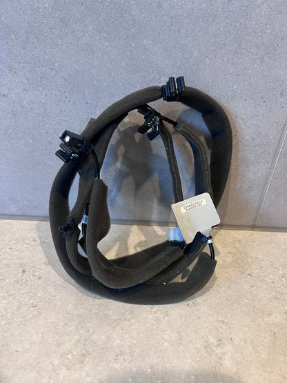 Foam-insulated automotive wire harness with clip connectors and bracket
