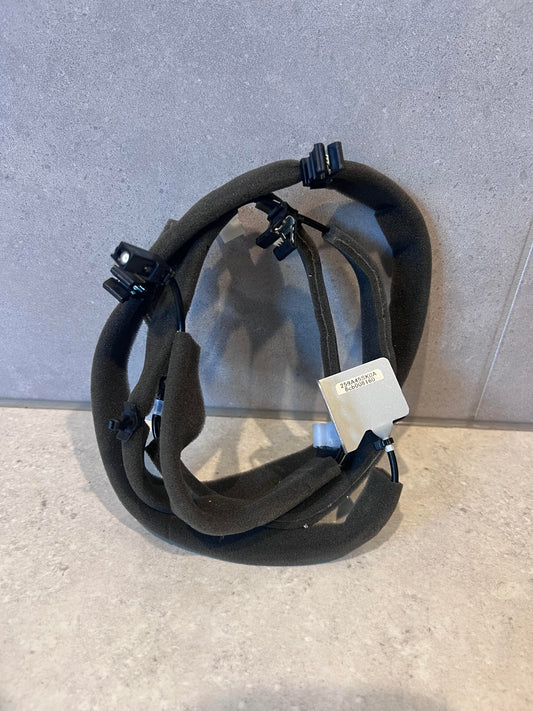Foam-insulated automotive wire harness with clip connectors and bracket