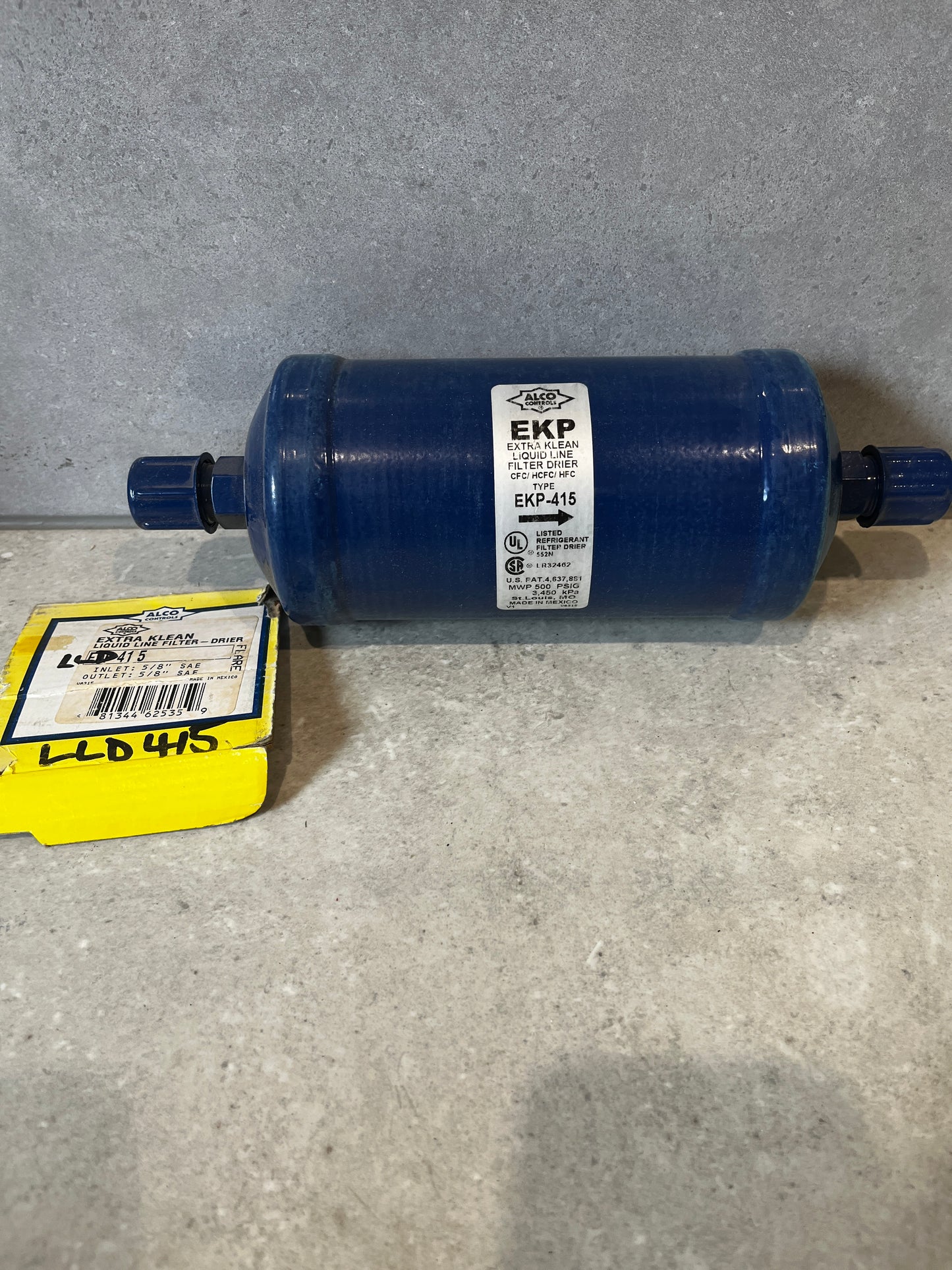 Alco EKP-415 Extra Klean Filter Drier with packaging on gray surface