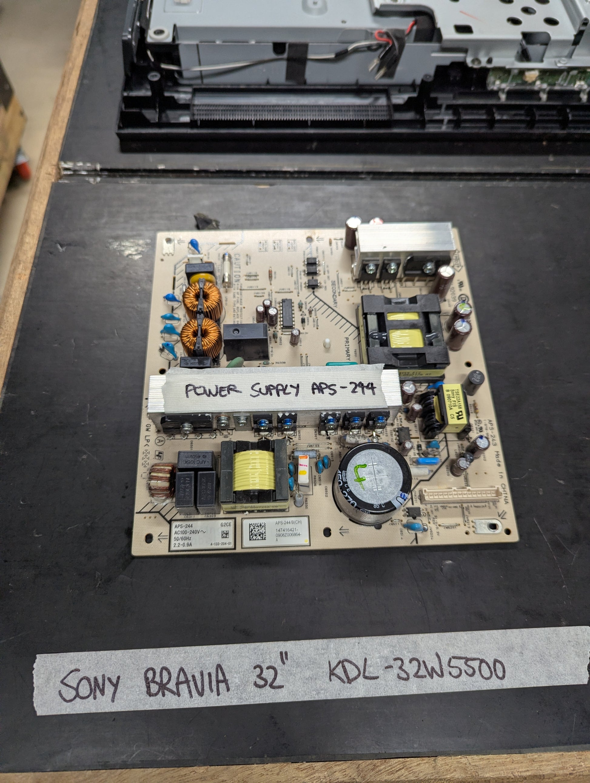 Sony Bravia APS-294 power supply board for 32-inch KDL-32W5500 TV on a dark work surface