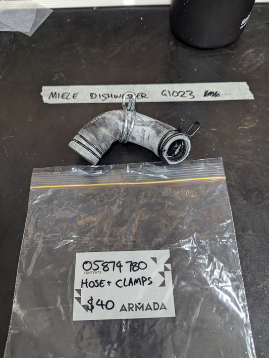 Miele dishwasher G1023 hose and clamps set on table with labeled bag