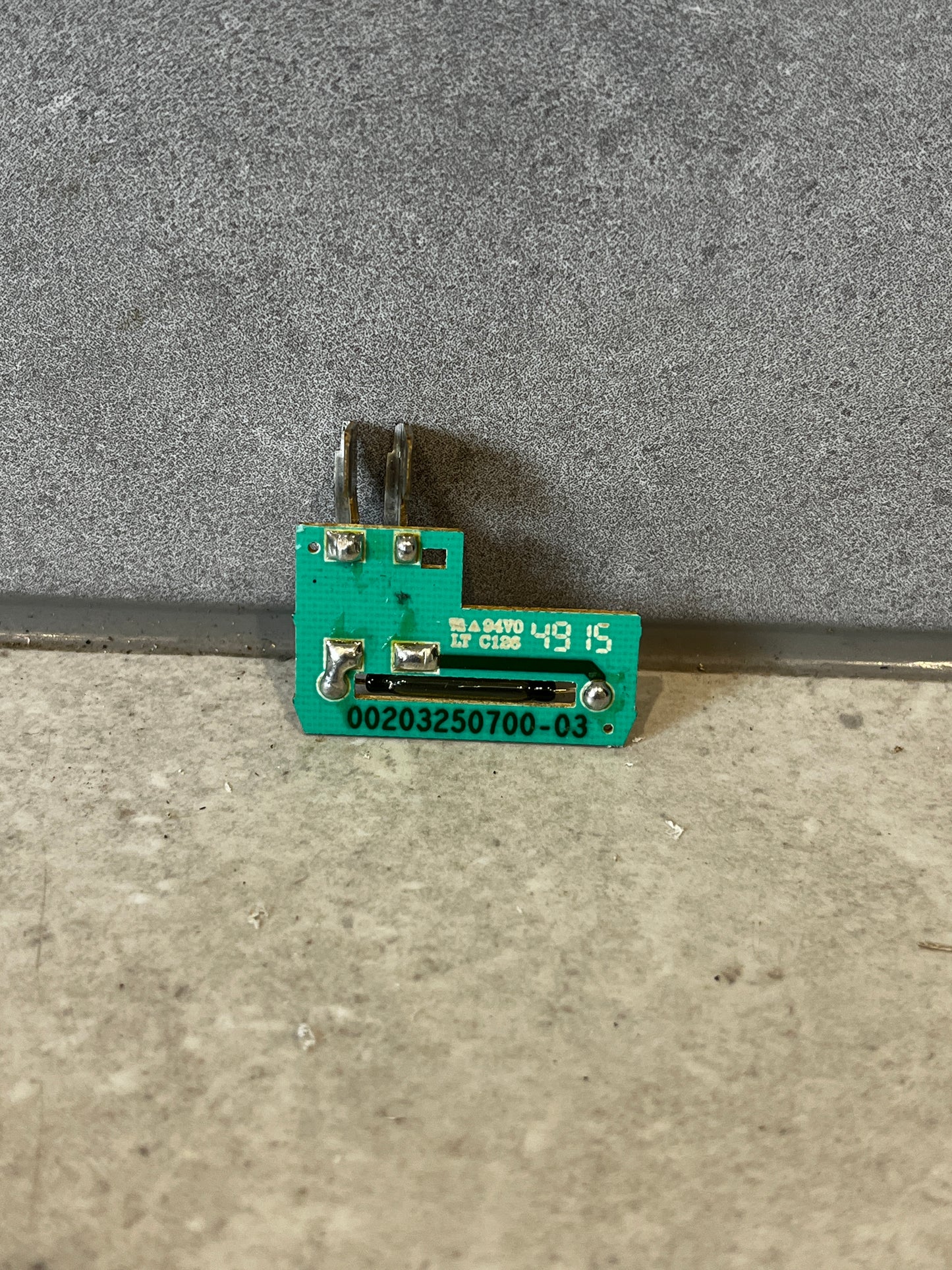 green printed circuit board module on stone surface