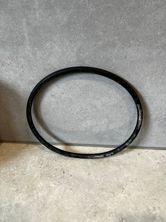 Black rubber O-ring gasket on a stone surface