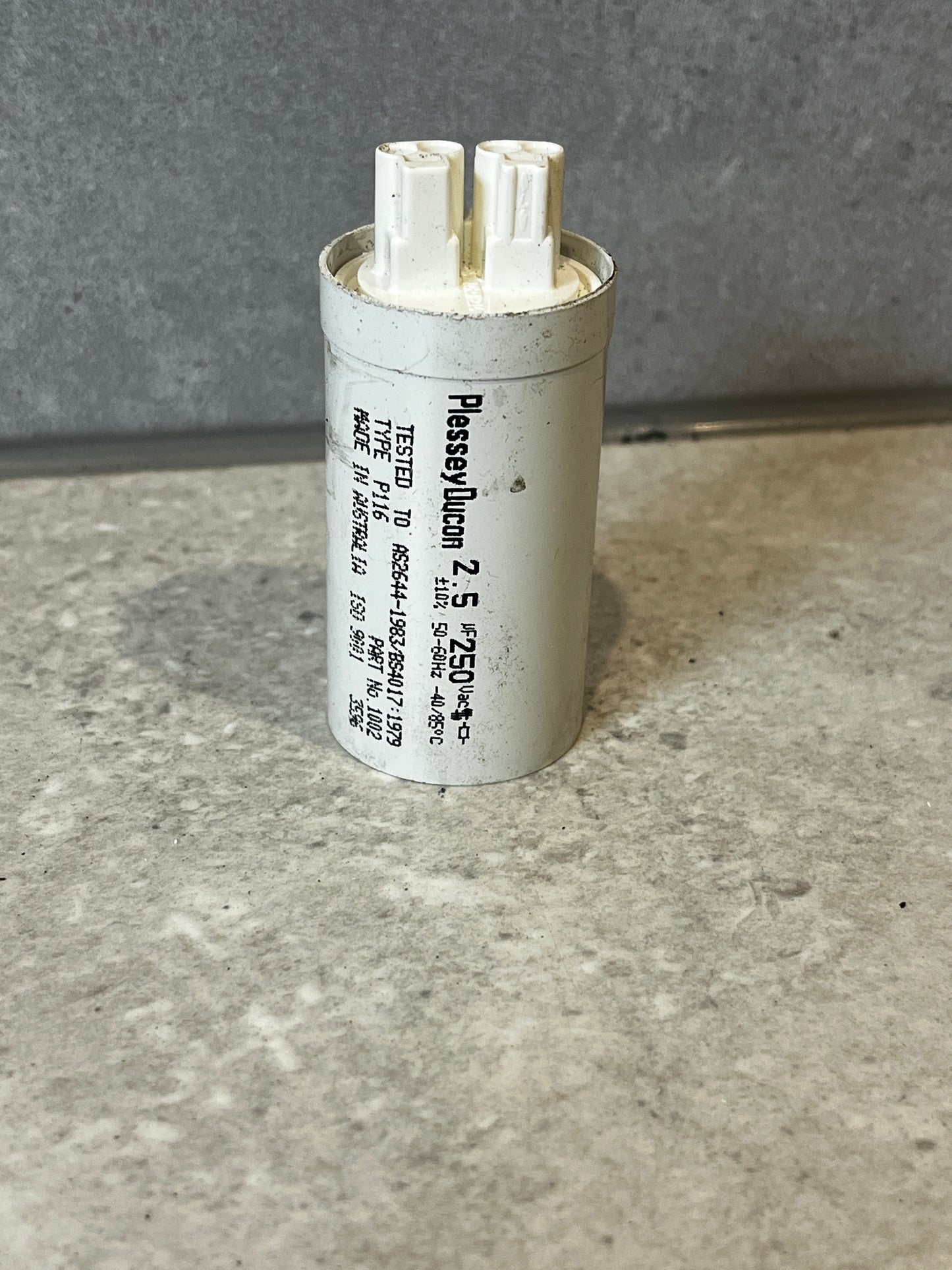 Plessey Ducon 2.5μF capacitor with dual terminals on a countertop