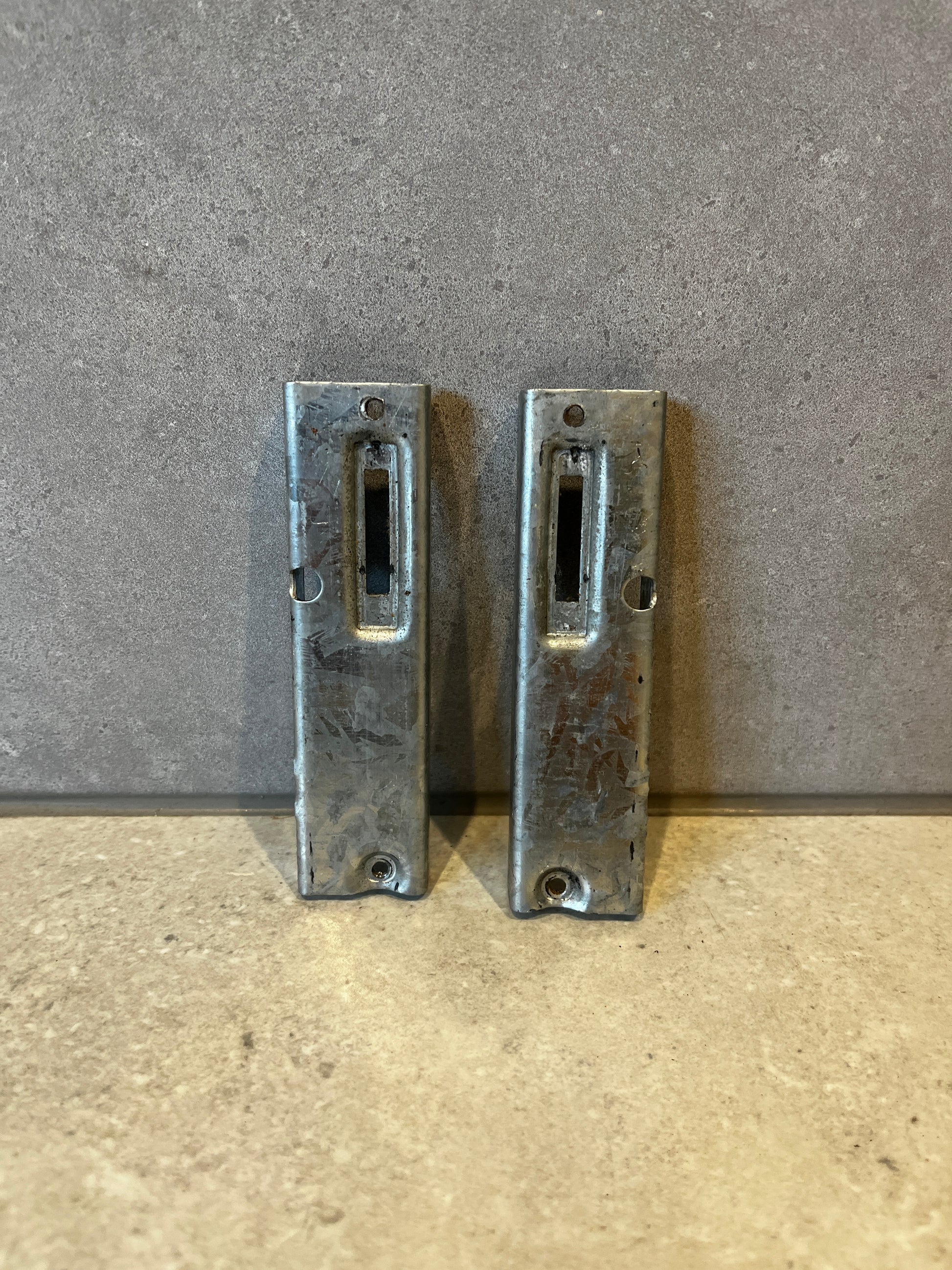 Pair of heavy-duty galvanized steel door strike plates