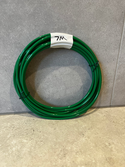 Coiled green polyurethane tubing labeled 7 meters