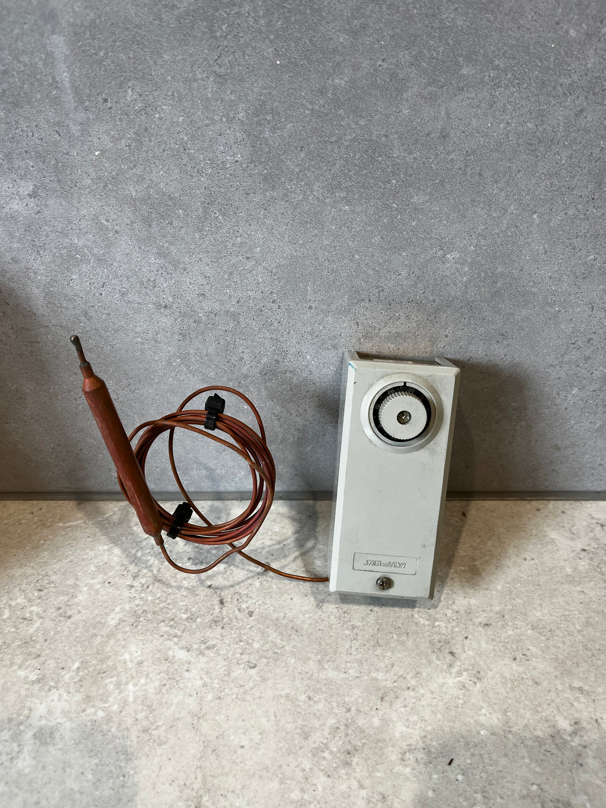 Front view of Katronika temperature controller with probe and cable