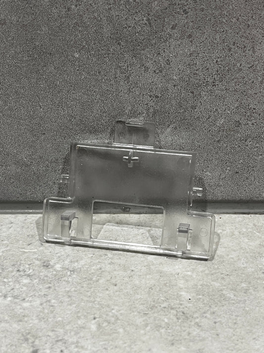 Clear plastic mounting bracket with clips and slots for secure attachment