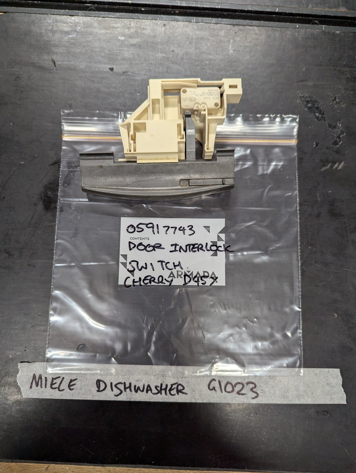Miele dishwasher G1023 door interlock switch replacement part on labeled bag