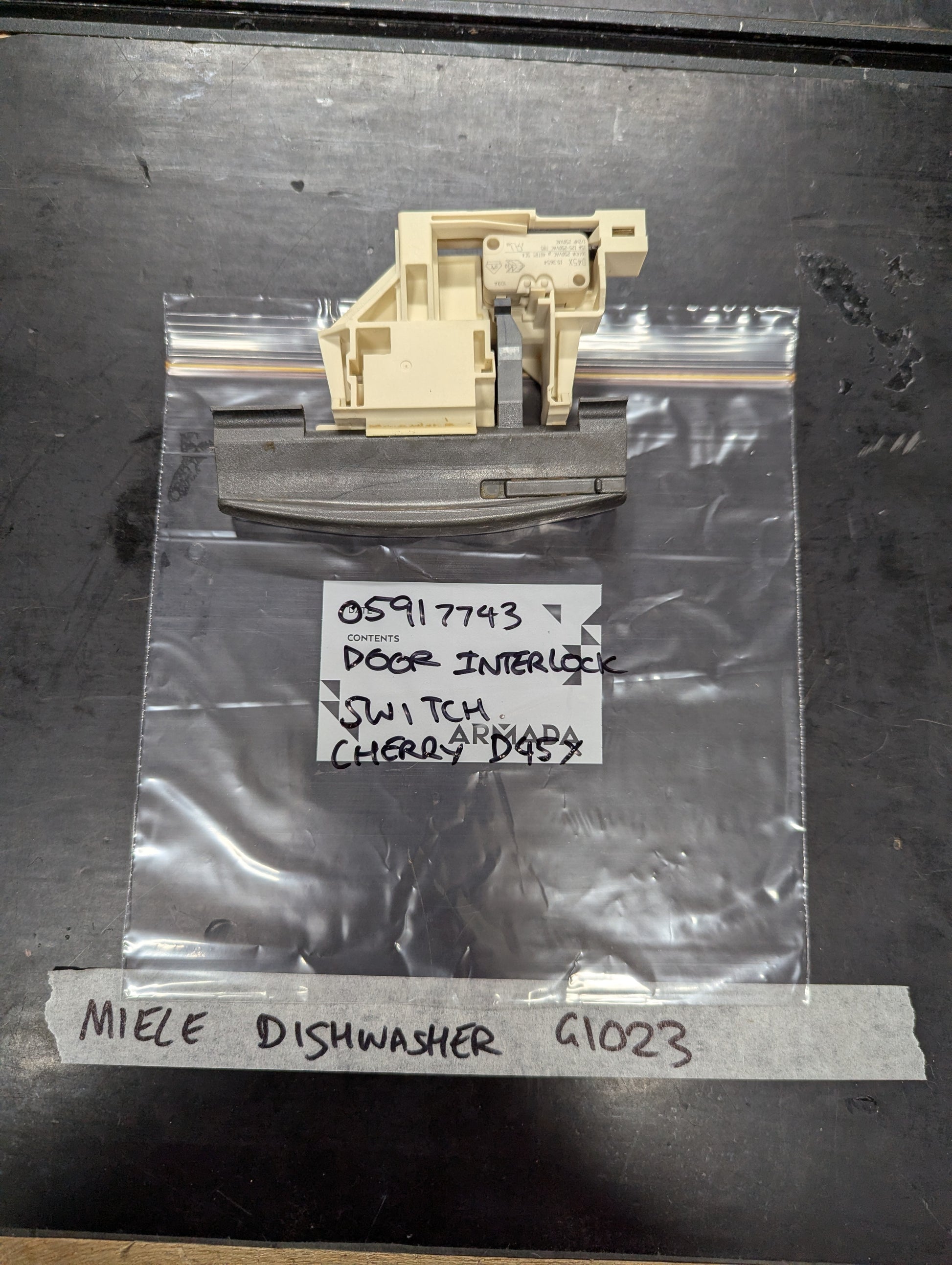 Miele dishwasher G1023 door interlock switch replacement part on labeled bag