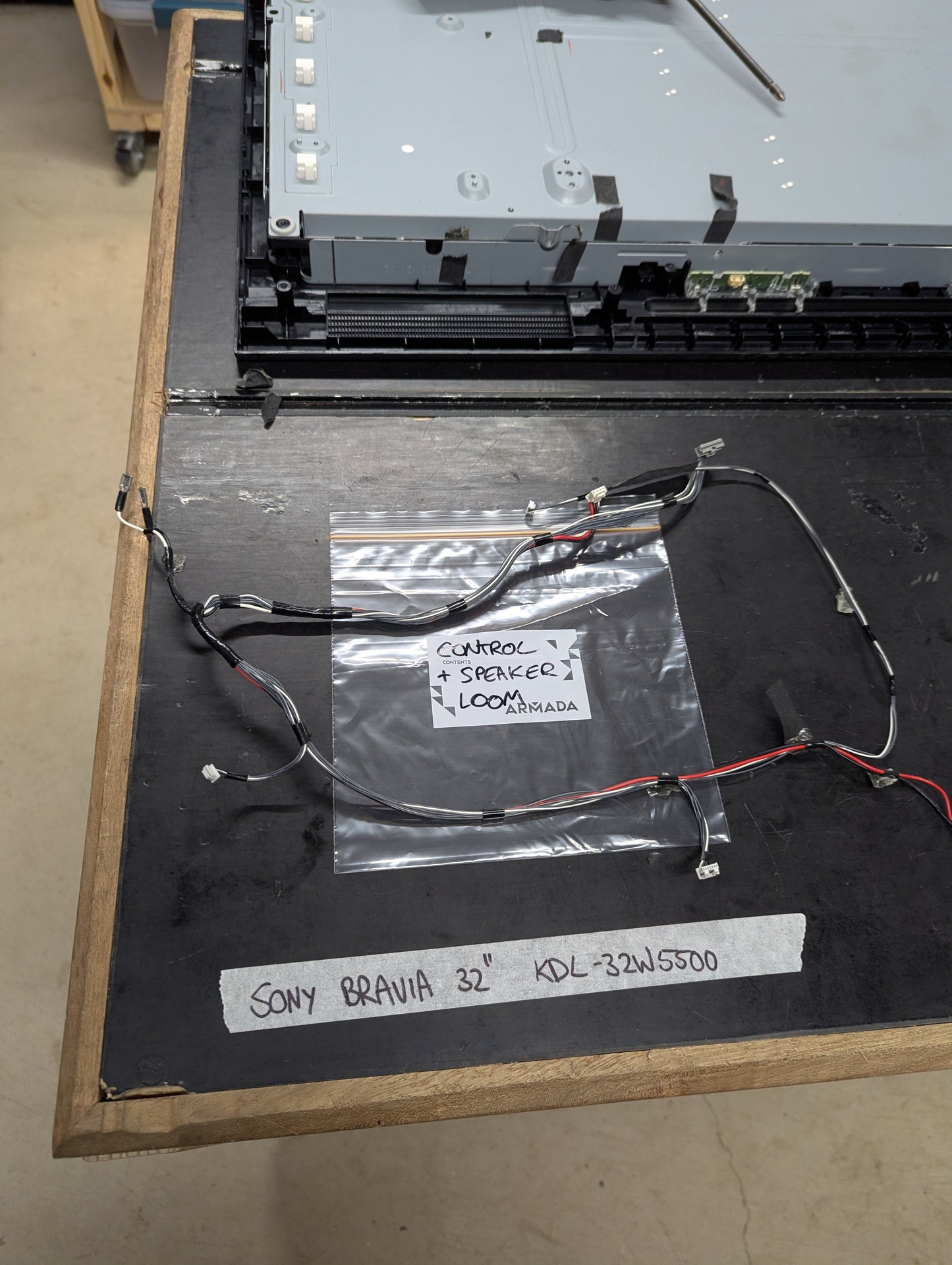 Sony Bravia KDL-32W5500 control and speaker loom wiring harness on workbench