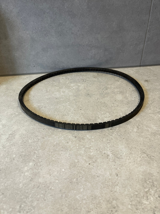 Dayco 13A1060C Drive V-Belt placed on a light stone surface