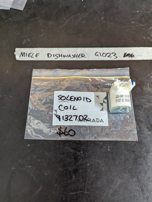 Miele dishwasher G1023 solenoid coil in labeled plastic bag on dark surface