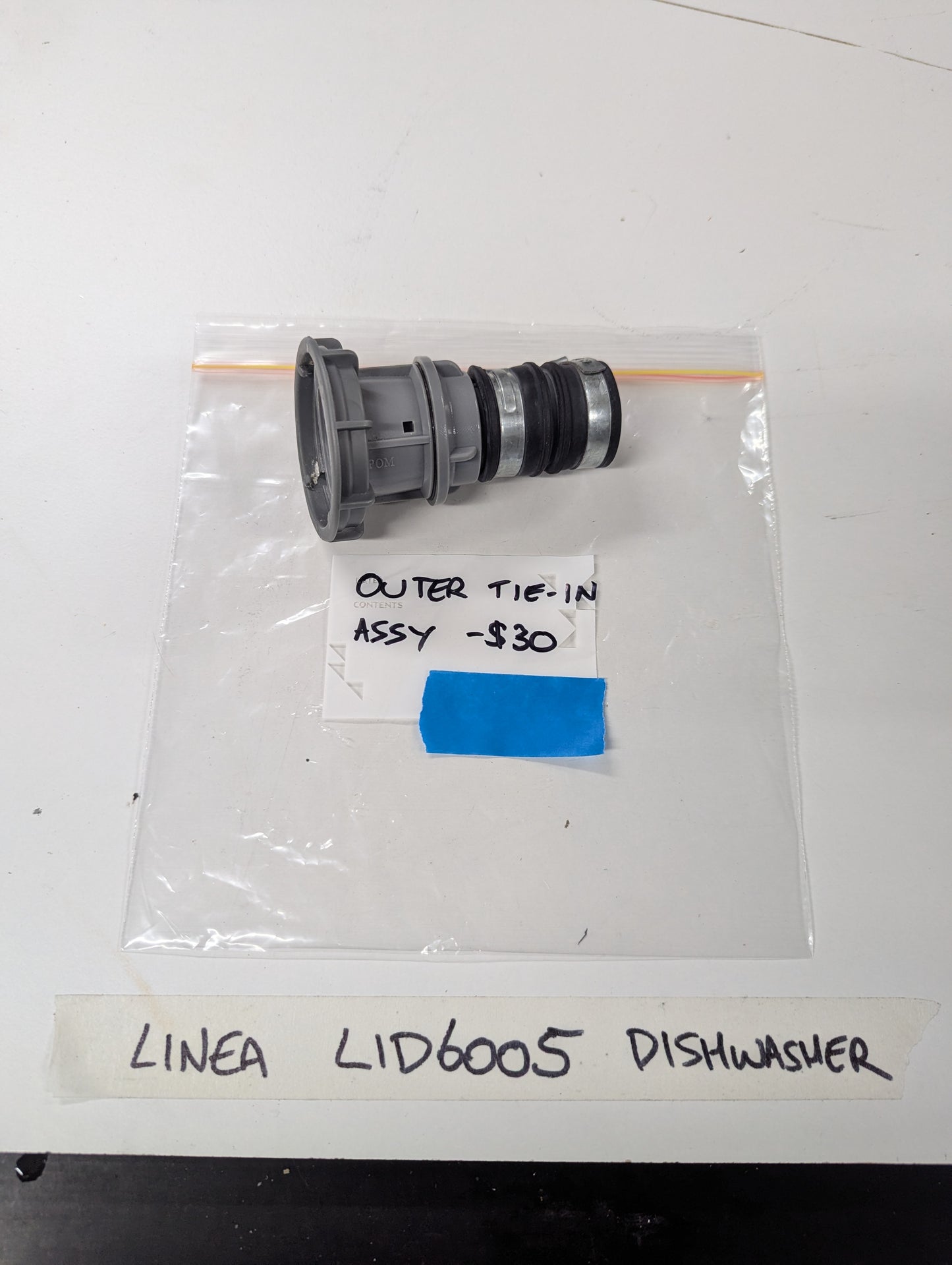 Linea LID6005 Dishwasher Outer Tie-In Assembly in plastic bag with label