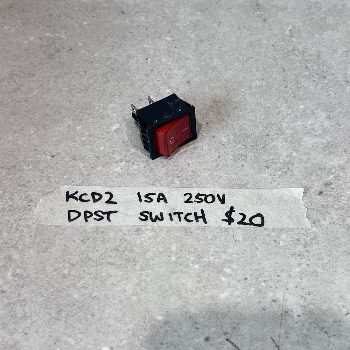 KCD2 15A 250V DPST switch for plasma cutter on gray surface