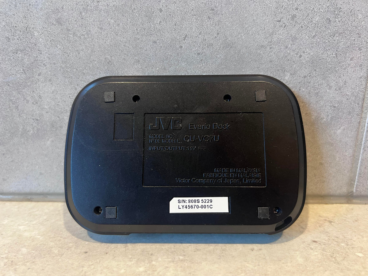 Bottom view of JVC CU-VC7U Everio Docking Station showing product label and serial number
