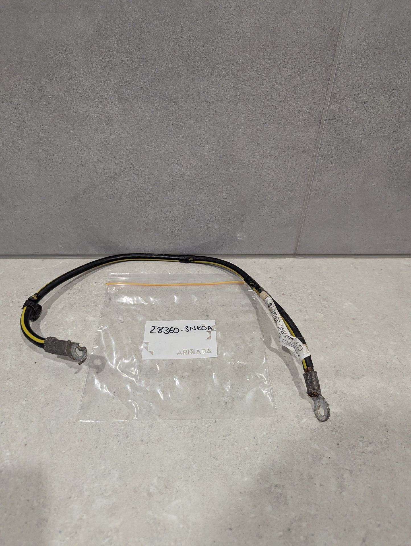 Automotive ground wire cable assembly with ring terminal connectors, labeled 2.8360-3NKOA