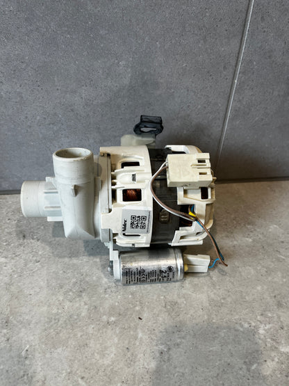 Side view of a washing machine drain pump motor assembly