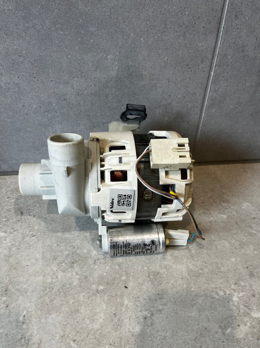 Side view of a washing machine drain pump motor assembly